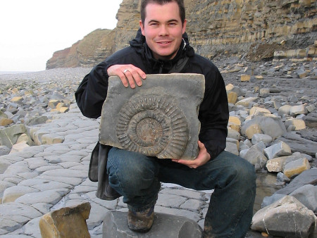 Roy Shepherd holding an ammonite at Quantoxhead
