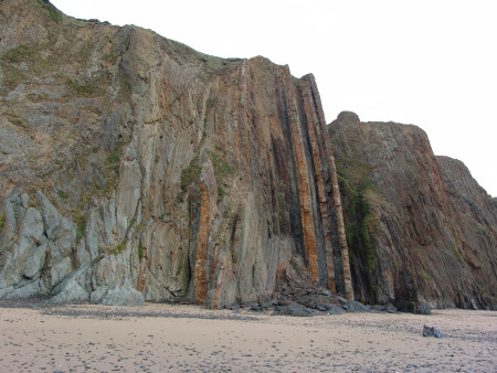 Vertical strata belonging to the Coralliferous Group at Marloes Sands
